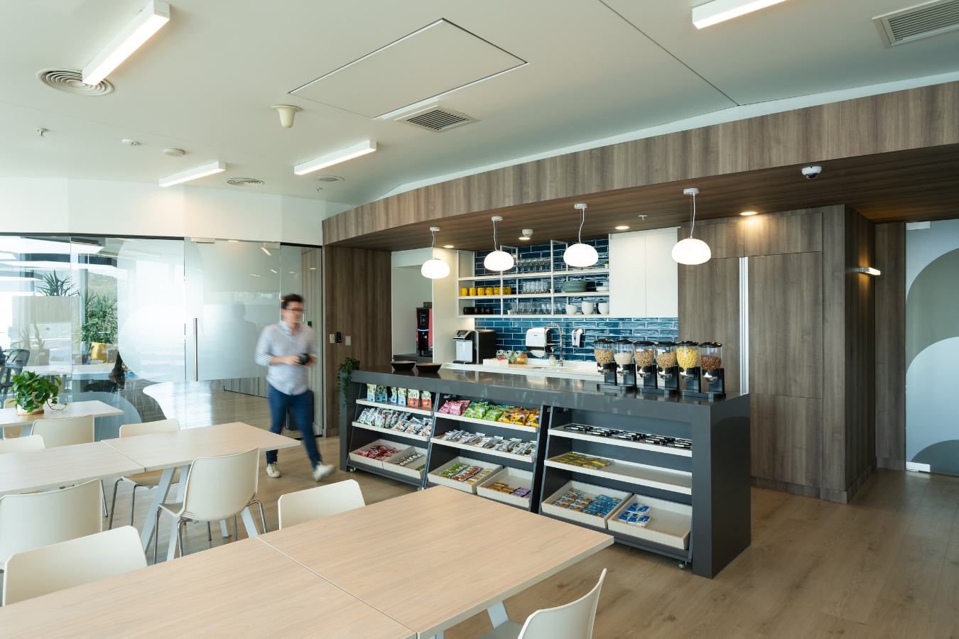 Checkr Offices - Office kitchenette and break area with light wood finishes and communal tables - Contract Workplaces.jpg